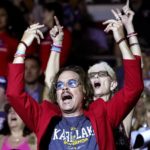 
              FILE - Supporters of former President Donald Trump cheer on Kari Lake, who is running for the Republican nomination for Arizona governor, during her speech at a Save America rally on July 22, 2022, in Prescott, Ariz. Lake, a well-known former television anchor, has delighted the segments of the GOP base that have long been at odds with their party’s establishment and want their leaders to confront Democrats, not compromise with them. (AP Photo/Ross D. Franklin, File)
            