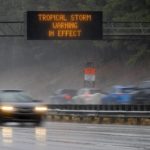 
              A North Carolina Department of Transportation sign along I-40 near RDU International Airport issues a Tropical Storm Warning, as remnants of Hurricane Ian move into the area on Friday, Sept. 30, 2022 in Cary, N.C. (Robert Willett/The News & Observer via AP)
            