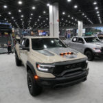 
              Dodge Ram pickup trucks during the media previews for the North American International Auto Show in Detroit, Wednesday, Sept. 14, 2022. This year's auto show will have fewer new model debuts, less-glitzy displays, fewer journalists and possibly lower attendance. (AP Photo/Paul Sancya)
            