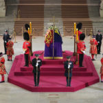 
              Black Rod walks through Westminster Hall at 06:29am to pay respect on the final day of the lying in state at the coffin of Queen Elizabeth II, draped in the Royal Standard with the Imperial State Crown and the Sovereign's orb and sceptre, lying in state on the catafalque in Westminster Hall, at the Palace of Westminster in London Monday, Sept. 19, 2022. (Yui Mok/Pool Photo via AP)
            