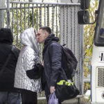 
              In this image taken from video, a Russian draftee kisses his partner before boarding a bus to be sent to the military units of the Eastern Military District, in Yakutsk, Russia, Friday, Sept. 23, 2022. Mobilization is underway in Russia's Far Eastern region of Yakutia after President Vladimir Putin ordered a partial mobilization of reservists Wednesday to bolster his forces in Ukraine. (AP Photo)
            