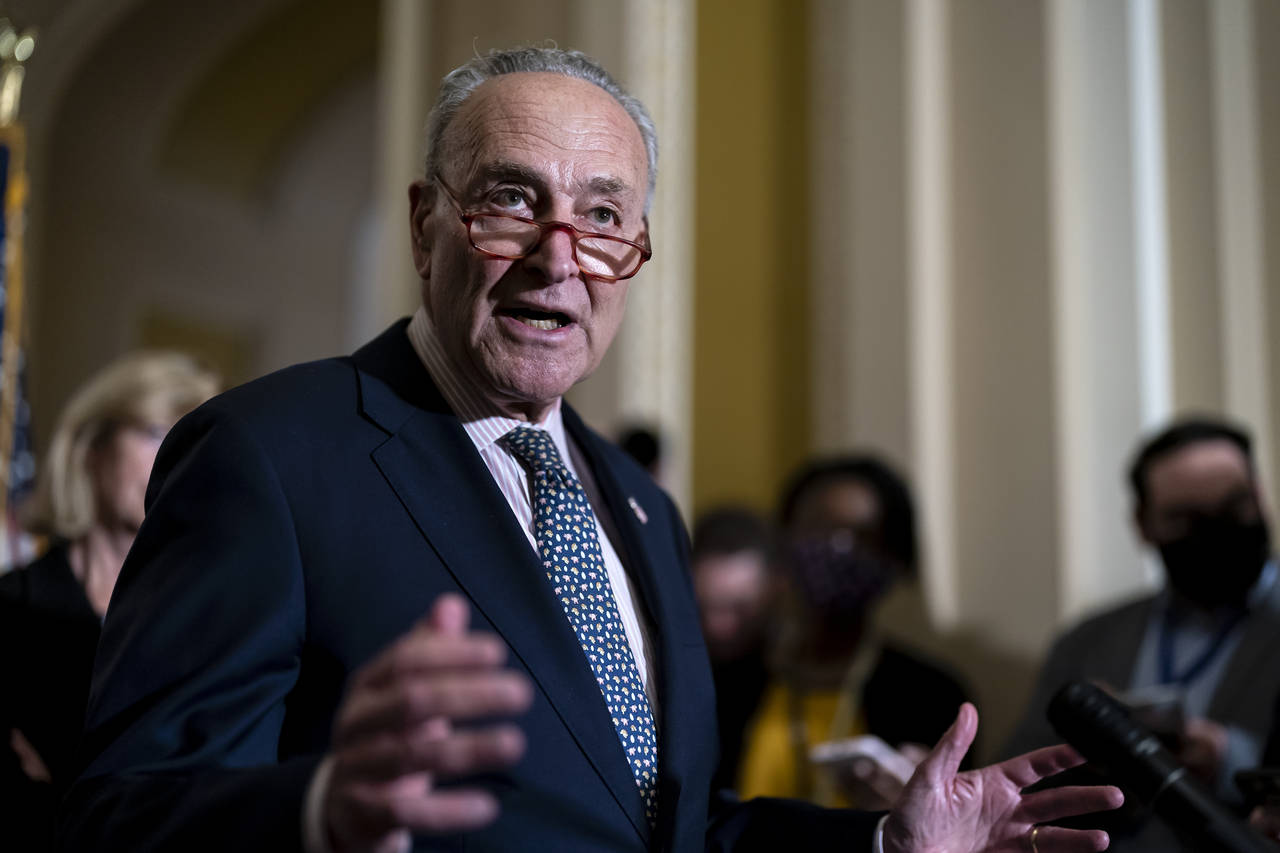 FILE - Senate Majority Leader Chuck Schumer, D-N.Y., speaks to reporters at the Capitol in Washingt...