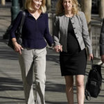 
              Former Theranos CEO Elizabeth Holmes, right, and her mother, Noel Holmes, arrive at federal court in San Jose, Calif., Thursday, Sept. 1, 2022. (AP Photo/Jeff Chiu)
            