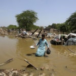 
              A man looks for salvageable belongings from his flooded home in the Shikarpur district of Sindh Province, Pakistan, Thursday, Sep. 1, 2022. Pakistani health officials on Thursday reported an outbreak of waterborne diseases in areas hit by recent record-breaking flooding, as authorities stepped up efforts to ensure the provision of clean drinking water to hundreds of thousands of people who lost their homes in the disaster. (AP Photo/Fareed Khan)
            