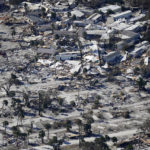 In this aerial photo made in a flight provided by mediccorps.org, damage from Hurricane Ian is seen on Estero Island in Fort Myers Beach, Fla., Friday, Sept. 30, 2022. (AP Photo/Gerald Herbert)