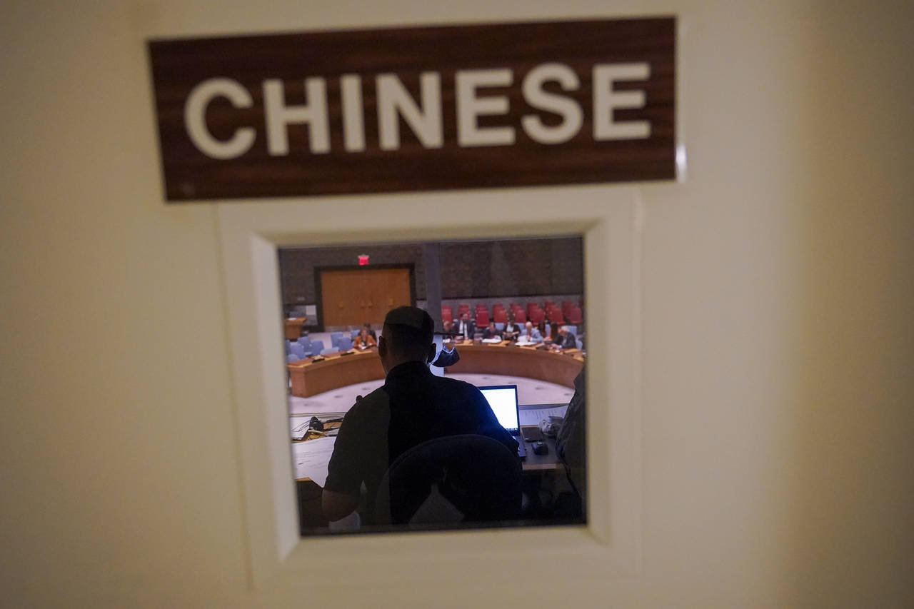 A Chinese translator works during a Security Council meeting at United Nations headquarters ahead o...