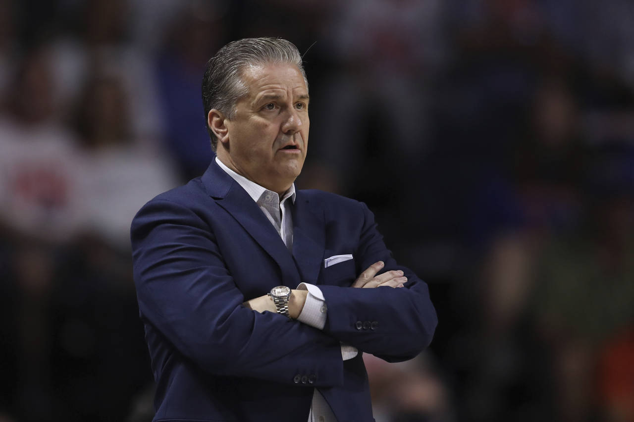 University of Kentucky men's basketball head coach John Calipari stands on the sidelines during the...