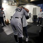 
              New York Yankees' Aaron Judge hugs his mother, Patty Judge, after the team's baseball game against the Toronto Blue Jays on Wednesday, Sept. 28, 2022, in Toronto. Judge hit his 61st home run of the season. (Nathan Denette/The Canadian Press via AP)
            