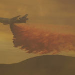 
              An air tanker drops retardant on a wildfire in Castaic, Calif. on Wednesday, Aug. 31, 2022. (AP Photo/Ringo H.W. Chiu)
            