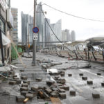 
              Debris caused by Typhoon Hinnamnor are seen at a waterfront park in Busan, South Korea, Tuesday, Sept. 6, 2022. The most powerful typhoon to hit South Korea in years battered its southern region Tuesday, dumping almost a meter (3 feet) of rain, destroying roads and felling power lines, leaving 20,000 homes without electricity as thousands of people fled to safer ground.(Sohn Hyung-joo/Yonhap via AP)
            