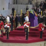 
              Queen Elizabeth II 's grandchildren, clockwise from front centre, Prince William, the Prince of Wales, Peter Phillips, James, Viscount Severn, Princess Eugenie, Prince Harry, the Duke of Sussex, Princess Beatrice, Lady Louise Windsor and Zara Tindall bow, during the vigil of the Queen's grandchildren, as they stand by the coffin of Queen Elizabeth II, as it lies in state, in Westminster Hall, at the Palace of Westminster, London, Saturday,  Sept. 17, 2022, ahead of her funeral on Monday. (Chris Jackson/Pool Photo via AP)
            