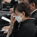 
              Akie Abe, widow of former Prime Minister of Japan Shinzo Abe, wipes away tears during the state funeral of her husband Tuesday Sept. 27, 2022, at Nippon Budokan in Tokyo. (AP Photo/Eugene Hoshiko, Pool) ///
            