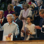 
              FILE - Britain's Queen Elizabeth II waves to the crowd as she arrives in the Royal Box in the gardens of Buckingham Palace Monday June 3, 2002, during the second concert to commemorate her Golden Jubilee. Others are, Prince Philip, left, Lady Sarah Chatto, second right, Prince Charles, right, and Camilla Parker Bowles, center second row (behind Chatto). After seven decades, the United Kingdom has a new woman to call queen. Camilla, Duchess of Cornwall, will be known as Queen Consort, a title that came with Queen Elizabeth II’s blessing after many years of contention, dating back to the years before she even married Prince Charles.  (Stephen Hird, Pool Photo via AP, File)
            