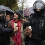 
              Police officers detain a demonstrator during a protest against a partial mobilization in Moscow, Russia, Saturday, Sept. 24, 2022. (AP Photo)
            