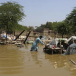 
              A man looks for salvageable belongings from his flood-damaged home in the Shikarpur district of Sindh Province, Pakistan, Thursday, Sept. 1, 2022. Pakistani health officials on Thursday reported an outbreak of waterborne diseases in areas hit by recent record-breaking flooding, as authorities stepped up efforts to ensure the provision of clean drinking water to hundreds of thousands of people who lost their homes in the disaster. (AP Photo/Fareed Khan)
            