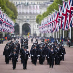 
              Police officers take positions ahead of the Queen Elizabeth II funeral in central London, Monday, Sept. 19, 2022. The Queen, who died aged 96 on Sept. 8, will be buried at Windsor alongside her late husband, Prince Philip, who died last year. (AP Photo/Vadim Ghirda, Pool)
            