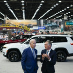 
              President Joe Biden speaks with Carlos Tavares, CEO of Stellantis, during a tour at the Detroit Auto Show, Wednesday, Sept. 14, 2022, in Detroit. (AP Photo/Evan Vucci)
            
