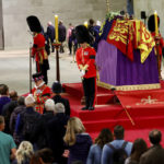 
              Royal guards stand by the coffin of Britain's Queen Elizabeth II, as members of the public pay their respects, following her death, during her lying-in-state at Westminster Hall, in Westminster Palace, in London, Sunday, Sept. 18, 2022. (Sarah Meyssonnier/Pool Photo via AP)
            