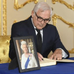 
              Paraguayan Ambassador to the UK Genaro Vicente Pappalardo signs a book of condolences at Lancaster House, following the death of Queen Elizabeth II, in London, Sunday, Sept. 18, 2022. ( Jonathan Hordle/Pool Photo via AP)
            