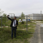 
              Independent lawmaker Akos Hadhazy, who has made a name for himself in Hungary as an anti-corruption crusader, snaps pictures at the site of a planned, but never finished government server farm to store the state's important data in God, Hungary, Wednesday, Sept. 14, 2022. The construction received nearly $40 million in EU funding in 2016, but was never finished, which Hadhazy says a clear sign of the missuse of EU funds. Hungarian prime minister Viktor Orban is facing a reckoning with the EU, which appears set to impose financial penalties on Hungary over corruption concerns and alleged rule-of-law violations that could cost Budapest billions and cripple its already ailing economy. (AP Photo/Anna Szilagyi)
            