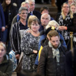 
              Members of the public file past the coffin of Queen Elizabeth II during the lying in State inside Westminster Hall, at the Palace of Westminster in London, Sunday, Sept. 18, 2022.  (Chip Somodevilla/Pool Photos via AP)
            