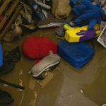 
              Shoes, video games, toys, stuffed animals and other belongings lay waterlogged at Damaris Colon´s home after Hurricane Fiona hit the island in Salinas, Puerto Rico, Tuesday, September 20, 2022. (AP Photo/Alejandro Granadillo)
            
