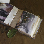 
              A photo album belonging to resident Luis Ramos Rosario lays in the mud inside his home that was flooded by Hurricane Fiona in Cayey, Puerto Rico, Tuesday, Sept. 20, 2022. Fiona hit Puerto Rico’s southwest corner on Sunday. (AP Photo/Stephanie Rojas)
            