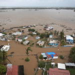 
              Homes are flooded on Salinas Beach after the passing of Hurricane Fiona in Salinas, Puerto Rico, Monday, Sept. 19, 2022. (AP Photo/Alejandro Granadillo)
            