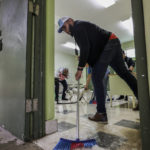 
              Volunteers remove the water brought by Hurricane Fiona at a storm shelter in Salinas, Puerto Rico, Monday, Sept. 19, 2022. (AP Photo/Stephanie Rojas)
            