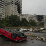 
              Destroyed cars are seen in an area next to apartment buildings that have been heavily damaged by Russian attacks on previous months at Saltivka neighborhood in Kharkiv, Ukraine, Thursday, Sept. 15, 2022. (AP Photo/Leo Correa)
            