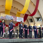 
              Organizers and guests participate in a ribbon-cutting ceremony during the annual Japan-China Exchange Festival at Tokyo's Yoyogi Park in Tokyo on Saturday, Sept. 24, 2022, marking the opening of the two-day friendship event and also marking the 50th anniversary of the Sept. 29, 1972, normalization of the ties between the two countries. The festival, after a two-year hiatus due to the COVID-19 pandemic, was back last weekend ahead of this week’s 50th anniversary of the normalizing of relations between the two Asian neighbors and economic powerhouses. (AP Photo/Mari Yamaguchi)
            