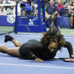 
              Serena Williams, of the United States, falls during a match against Ajla Tomljanovic, of Australia, during the third round of the U.S. Open tennis championships, Friday, Sept. 2, 2022, in New York. (AP Photo/John Minchillo)
            