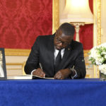
              Malawi's Minister for Information and Digitisation Gospel Kazako signs a book of condolences at Lancaster House following the death of Queen Elizabeth II, in London, Sunday, Sept. 18, 2022. ( Jonathan Hordle/Pool Photo via AP)
            