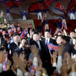 
              This photo provided by the North Korean government shows North Korean leader Kim Jong Un, center, waves to the participants during a celebration marking the nation's 74th anniversary in Pyongyang, North Korea, on Sept. 8, 2022. Independent journalists were not given access to cover the event depicted in this image distributed by the North Korean government. The content of this image is as provided and cannot be independently verified. Korean language watermark on image as provided by source reads: "KCNA" which is the abbreviation for Korean Central News Agency. (Korean Central News Agency/Korea News Service via AP)
            