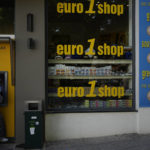 
              FILE - A woman uses an ATM machine in the main town of the Aegean Sea island of Rhodes, southeastern Greece, Tuesday, May 10, 2022.  Inflation in 19 European countries using the euro currency hits another record at 10% as energy prices soar. (AP Photo/Thanassis Stavrakis, File)
            