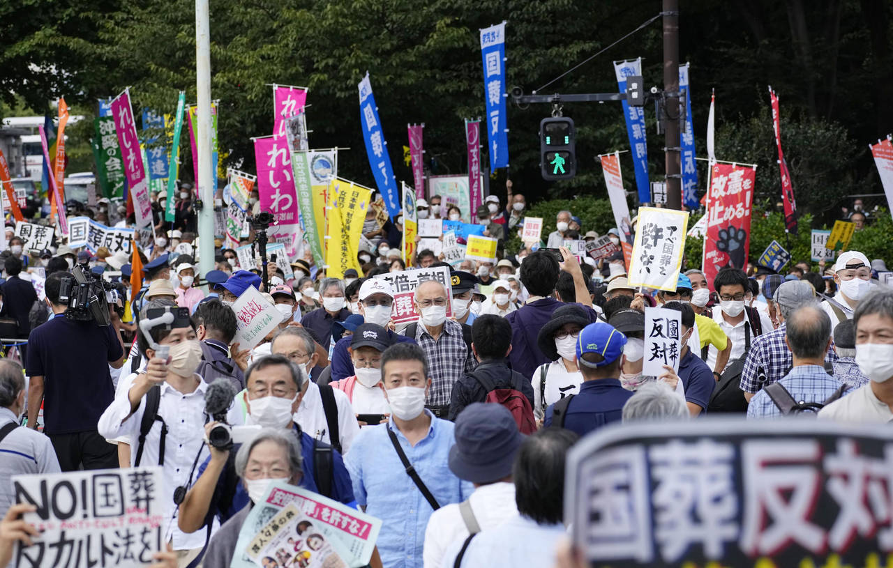 A street near the parliament is packed with protesters against a state funeral for Japan's former P...