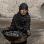 
              A 9-year-old Afghan girl works in a brick factory on the outskirts of Kabul, Afghanistan, Saturday, Aug. 20, 2022. Aid agencies say the number of children working in Afghanistan is growing ever since the economy collapsed following the Taliban takeover more than a year ago. (AP Photo/Ebrahim Noroozi)
            