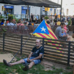 
              Protesters hold esteladas or independence flags as they take part in a demonstration during the Catalan National Day in Barcelona, Spain, Sunday, Sept. 11, 2022. Thousands of Spaniards who support the secession of Catalonia are gathering in Barcelona on the region's main holiday. (AP Photo/Joan Mateu Parra)
            