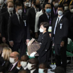 
              Akie Abe, widow of former Prime Minister of Japan Shinzo Abe, arrives with her husband's remains at the state funeral Tuesday Sept. 27, 2022, at Nippon Budokan in Tokyo. (AP Photo/Eugene Hoshiko, Pool) ///
            
