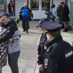 
              FILE A Russian recruit hugs his mother at a military recruitment center in Volgograd, Russia, Saturday, Sept. 24, 2022. Russian President Vladimir Putin on Wednesday ordered a partial mobilization of reservists to beef up his forces in Ukraine. (AP Photo, File)
            
