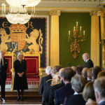 
              Britain's King Charles III, with the Queen Consort, listen to a message of condolence from Alex Maskey, Speaker of the Northern Ireland Assembly, right, at Hillsborough Castle, Belfast, Tuesday Sept. 13, 2022, following the death of Queen Elizabeth II. King Charles III and Camilla, the Queen Consort, flew to Belfast from Edinburgh on Tuesday, the same day the queen’s coffin will be flown to London from Scotland. (Niall Carson/Pool via AP)
            
