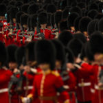 
              Guardsmen take their positions ahead of the Queen Elizabeth II funeral in central London, Monday, Sept. 19, 2022. The Queen, who died aged 96 on Sept. 8, will be buried at Windsor alongside her late husband, Prince Philip, who died last year. (AP Photo/Vadim Ghirda, Pool)
            