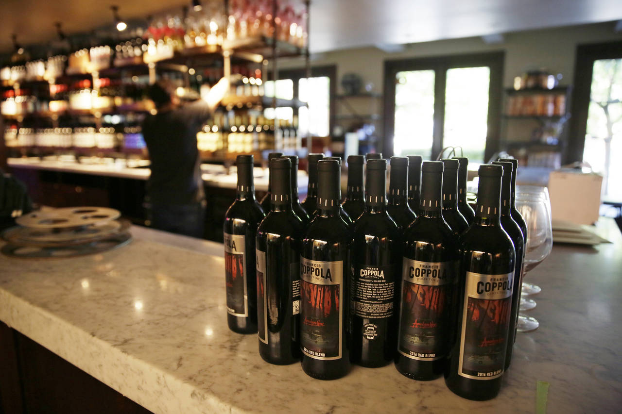 FILE - Bottles of Apocalypse Now Red Blend wine stand on a tasting bar counter at the Francis Ford ...
