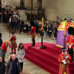 
              Members of the public pay their respects as they pass the coffin of Queen Elizabeth II, Lying in State inside Westminster Hall, at the Palace of Westminster in London, Sunday, Sept. 18, 2022. (Adrian Dennis/Pool Photo via AP)
            