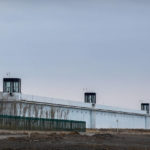 
              FILE - People stand in a guard tower on the perimeter wall of the Urumqi No. 3 Detention Center in Dabancheng in western China's Xinjiang Uyghur Autonomous Region on April 23, 2021. After a U.N. report concluding that China's crackdown in the far west Xinjiang region may constitute crimes against humanity, China used a well-worn tactic to deflect criticism: blame a Western conspiracy. (AP Photo/Mark Schiefelbein, File)
            