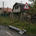 
              A part of a rocket is seen on the ground in the retaken village of Bohorodychne, eastern Ukraine, Friday, Sept. 23, 2022. (AP Photo/Leo Correa)
            