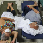 
              Residents affected by Hurricane Fiona rest at a storm shelter in Salinas, Puerto Rico, Monday, Sept. 19, 2022. (AP Photo/Stephanie Rojas)
            