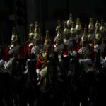 
              Royal mounted guards escort the coffin of Queen Elizabeth II to Westminster Abbey for her funeral in central London, Monday, Sept. 19, 2022. The Queen, who died aged 96 on Sept. 8, will be buried at Windsor alongside her late husband, Prince Philip, who died last year. (AP Photo/Petr David Josek, Pool)
            