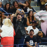 
              Alexis Ojanian, center, takes a selfie with guests in Serena Williams' box, as Venus Williams, far right, looks on during the third round of the U.S. Open tennis championships, Friday, Sept. 2, 2022, in New York. (AP Photo/Frank Franklin II)
            