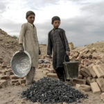 
              Afghan children work in a brick factory on the outskirts of Kabul, Afghanistan, Saturday, July 23, 2022. Aid agencies say the number of children working in Afghanistan is growing ever since the economy collapsed following the Taliban takeover more than a year ago. (AP Photo/Ebrahim Noroozi)
            